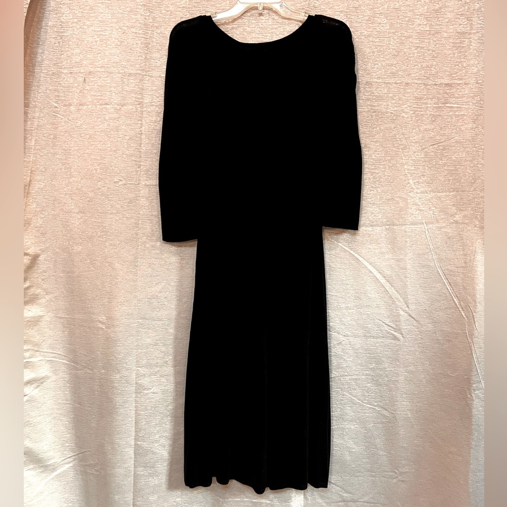 Black, light knit, dress. Beyond knee length. Fitted waste.
